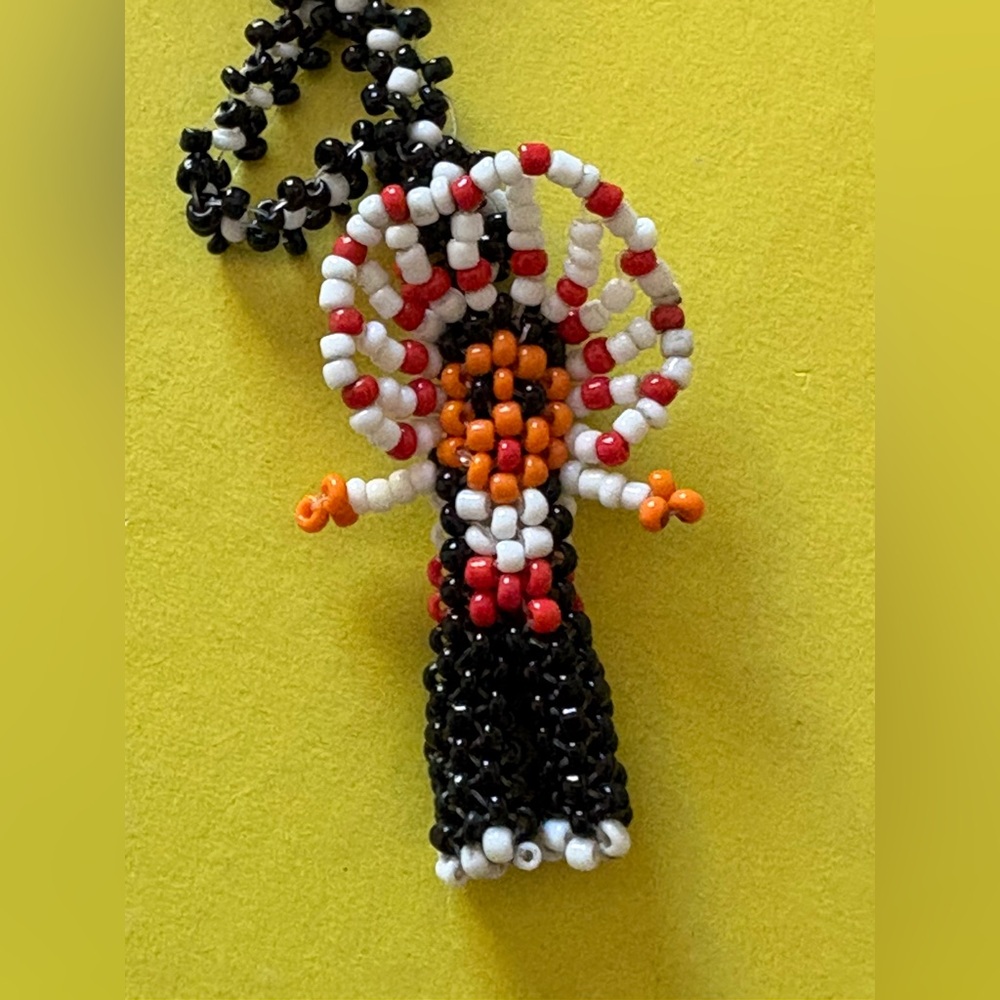 Seed Beaded Figure w/Headdress.
